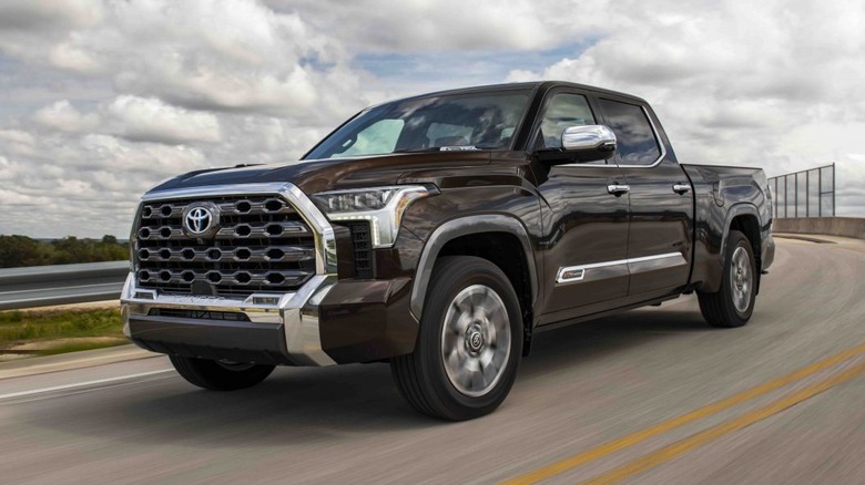 Black Toyota Tundra cornering on a road