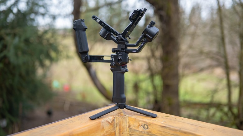 The DJI RS 5 on a porch railing.