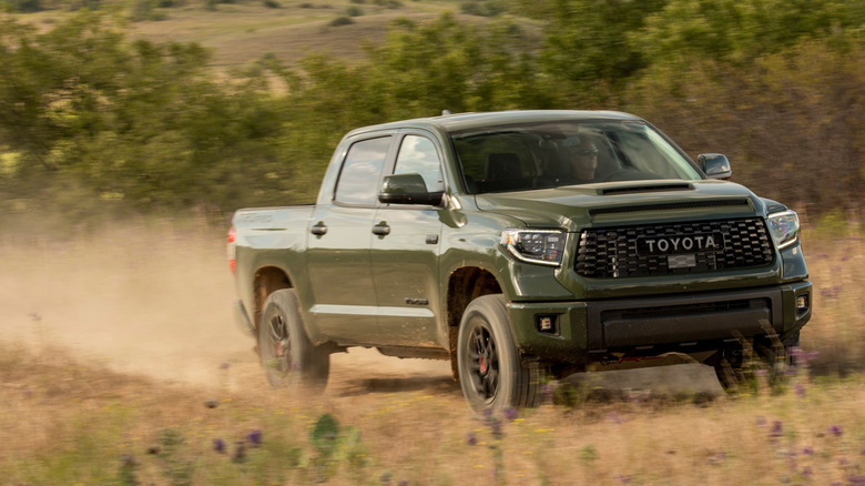 Green 2020 Toyota Tundra on dirt trail