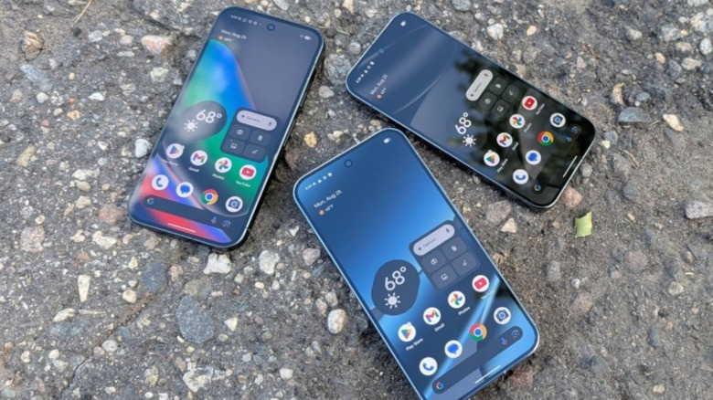 Three Google Pixel 10 Pro XL smartphones posed on ground