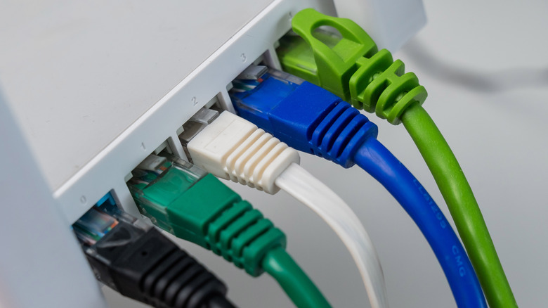 Colorful cables that are connected to a router