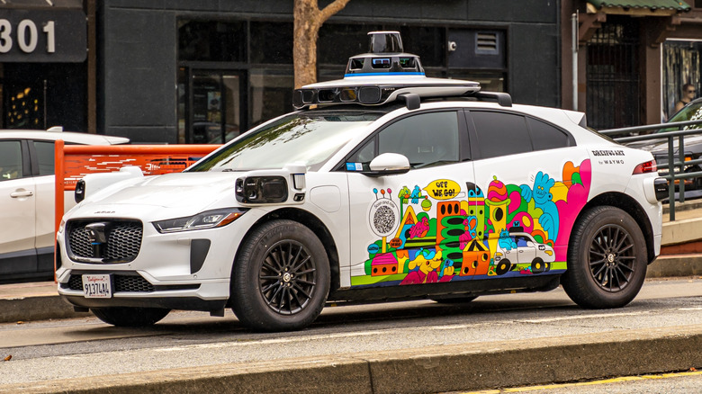 Waymo Jaguar iPace robotaxi on city street