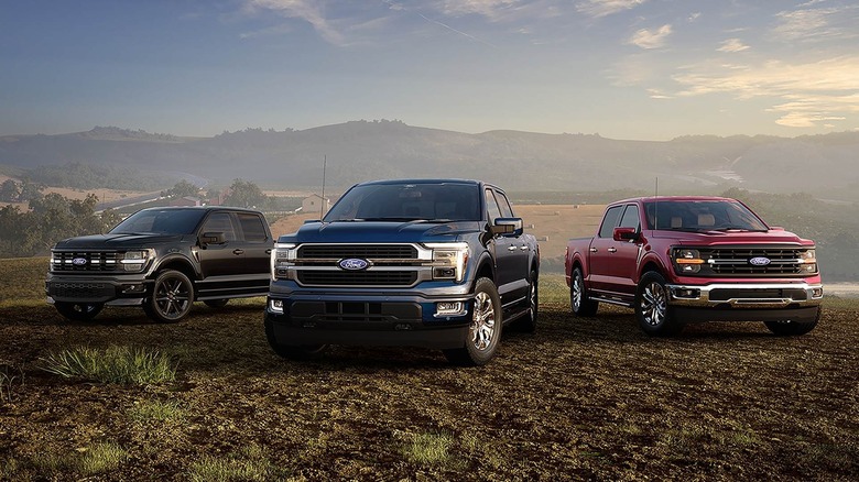 Different trims of the 2026 Ford F-150 parked in a deserted area
