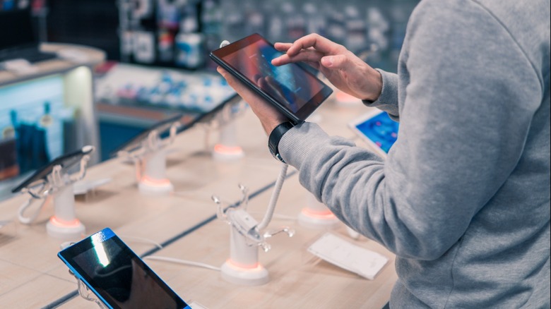 Customer tests tablet on display