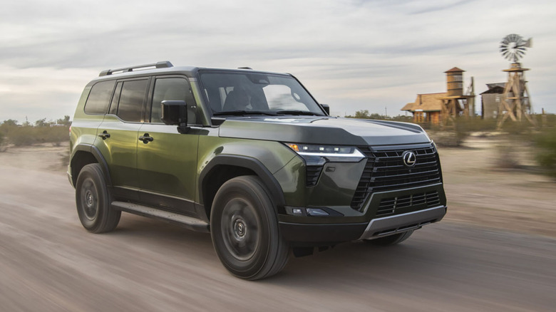 Green 2026 Lexus GX on dirt road