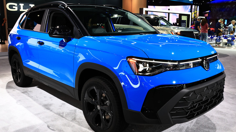 Blue 2026 Volkswagen Taos SE at auto show