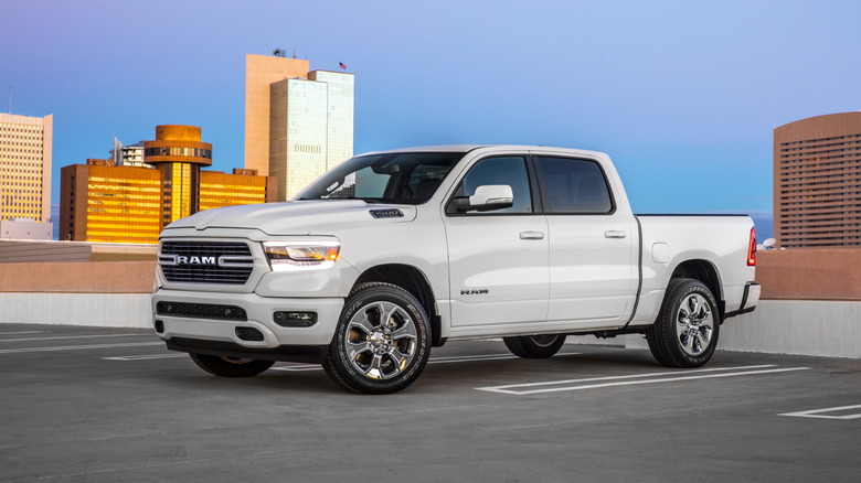 A side shot of a white 2020 Ram 1500 parked