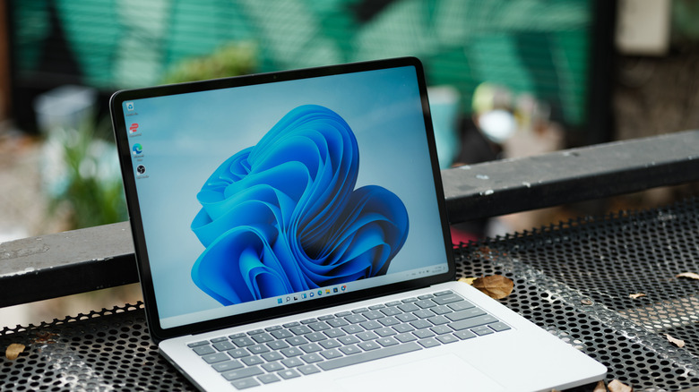 A laptop running Windows 11 with the default light mode wallpaper