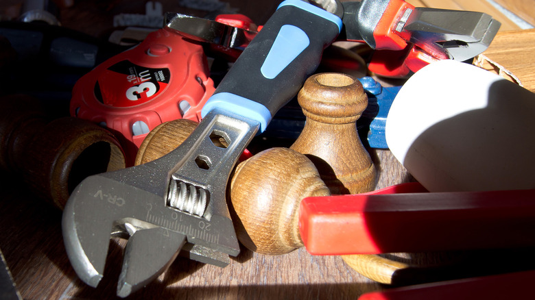 A pile of tools and components one might use to do home improvement projects.