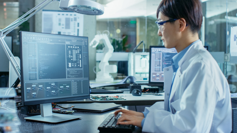 scientist researching at computer
