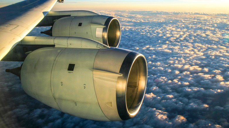 A close-up of unidentified airplane engines in the sky