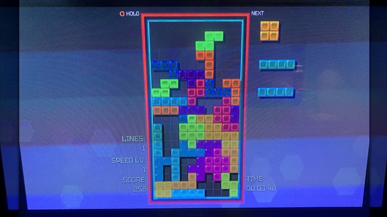 "Tetris Time Warp" gameplay on TV screen