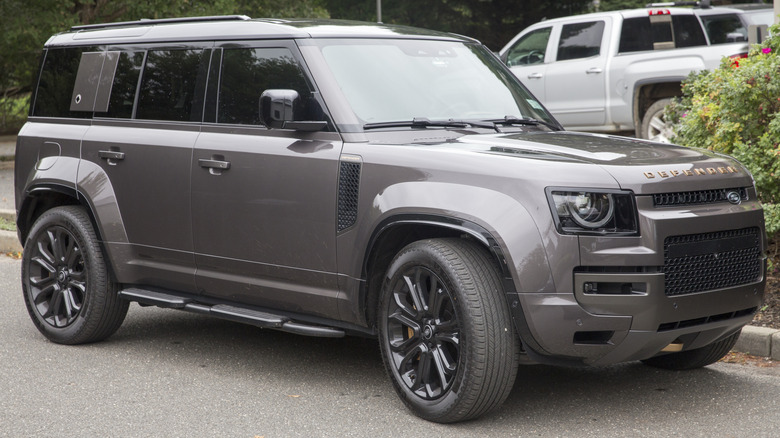 Land Rover Defender parked on the curb