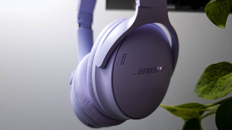 Bose QuietComfort SC hanging near plants and mounted TV