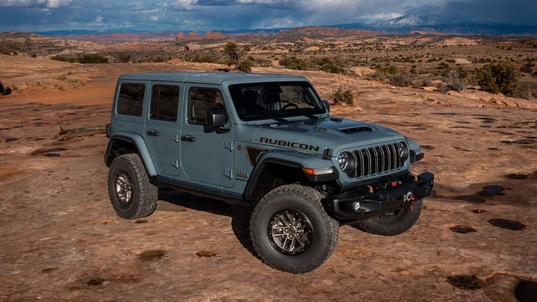 A Jeep Wrangler 392 Rubicon in a desert, front 3/4 view
