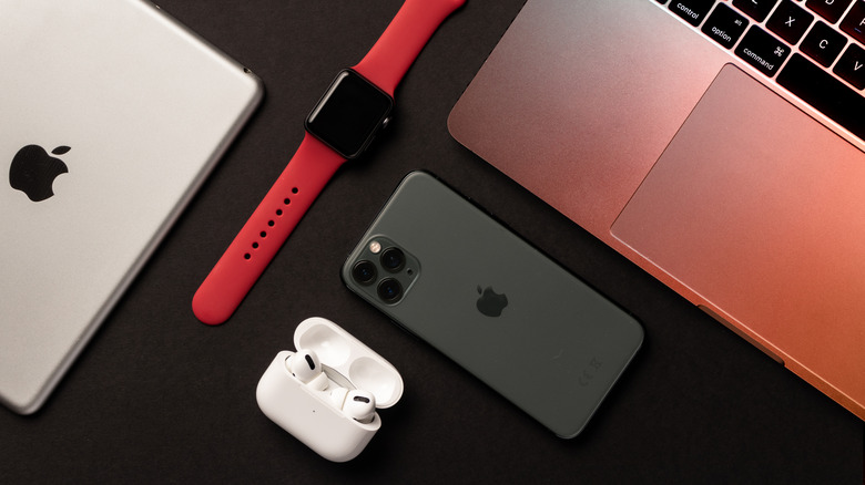 Multiple Apple devices set out on a table.