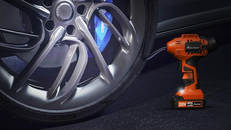 An Avid Power tire inflator connected to a tire.
